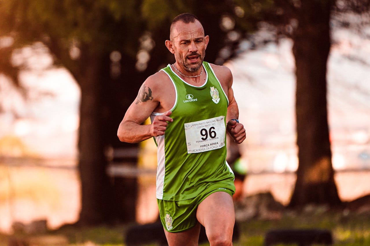 Determined man competing in an outdoor race, captured mid-motion in vibrant sportswear.